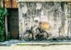 Street art George Town Malaysia Little Childrel on a Bicycle